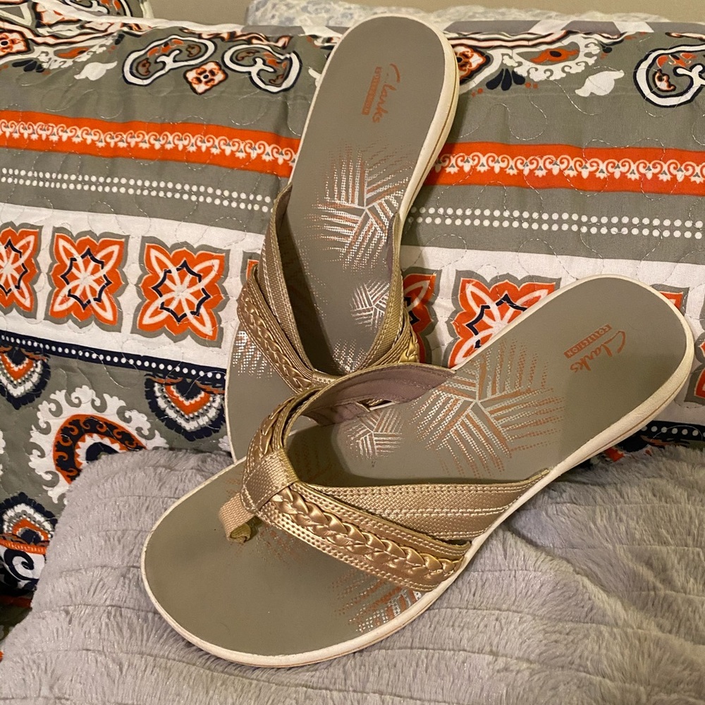 Clark’s gold thong sandal.